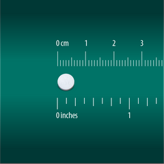 A Globe Chewable Mint Antacid Tablet, used for heartburn, acid indigestion, and upset stomach relief, is shown next to a ruler with centimeters and inches. The round white tablet is about 0.5 cm (0.2 in) in diameter.
