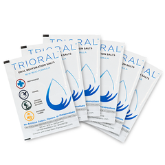 Six TRIORAL Oral Rehydration Salts packets are fanned out, each white with a blue droplet graphic—ideal for distributor orders or anyone needing a large supply with 600 packets per carton.