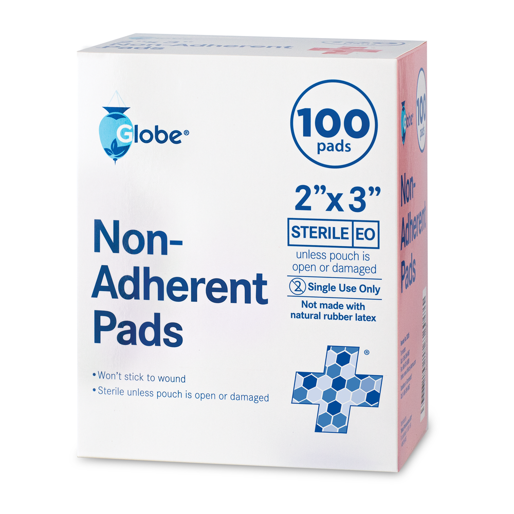 A white and blue Globe box labeled "Sterile Non-Adherent Pads 2\" x 3\"" contains 100 sterile, highly absorbent, non-stick wound pads. Individually wrapped for protection; not made with natural rubber latex. Blue hexagon pattern at lower right.