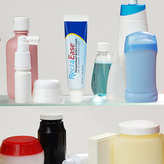 Personal care and medication containers are arranged on glass shelves. The centerpiece is RECTAEASE RectaEase, a lidocaine 5% topical anorectal numbing cream for fast hemorrhoid relief and other anorectal disorders.