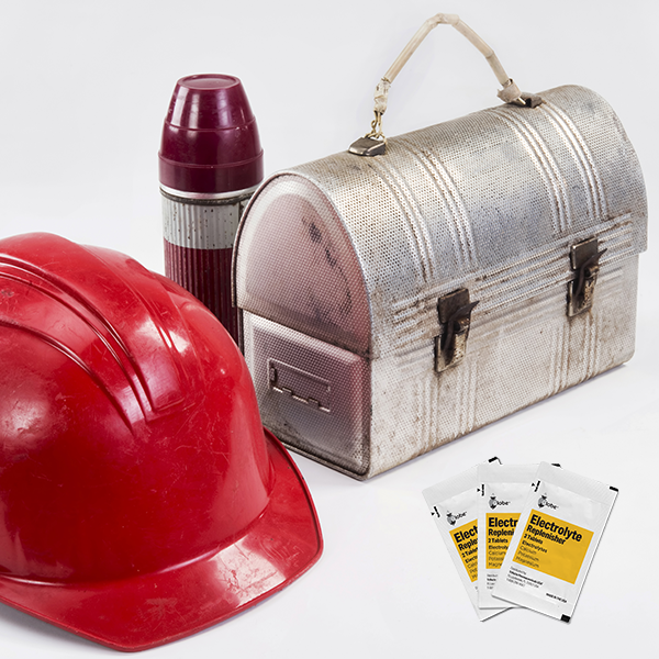 A red hard hat, silver lunchbox, maroon thermos, and Globe Electrolyte Replacement Tablets for rehydration (250 packets) are displayed against a white background.