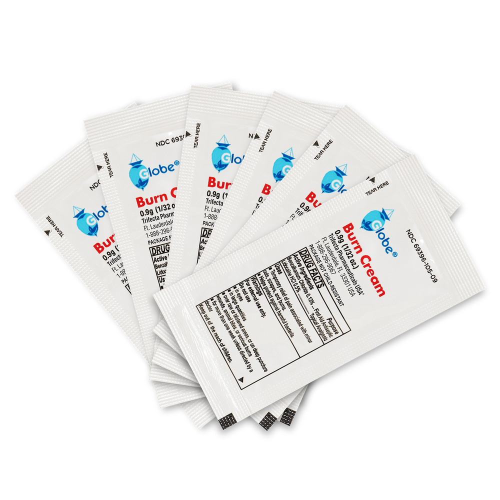Six Globe First Aid Burn Cream 0.9g packets, featuring blue and red text on a white background, are arranged in a fan shape. Each small packet displays the Globe brand logo, essential product details, and emphasizes its use as a first aid cream for temporary relief of minor burns, cuts, and scrapes.