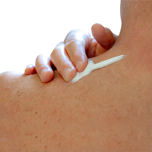 A person applying Globe Capsaicin 0.1% High Potency Pain Relief Cream (2 oz) by Globe to their upper back and shoulder for deep penetrating relief from arthritis, muscle, joint, and back pain.