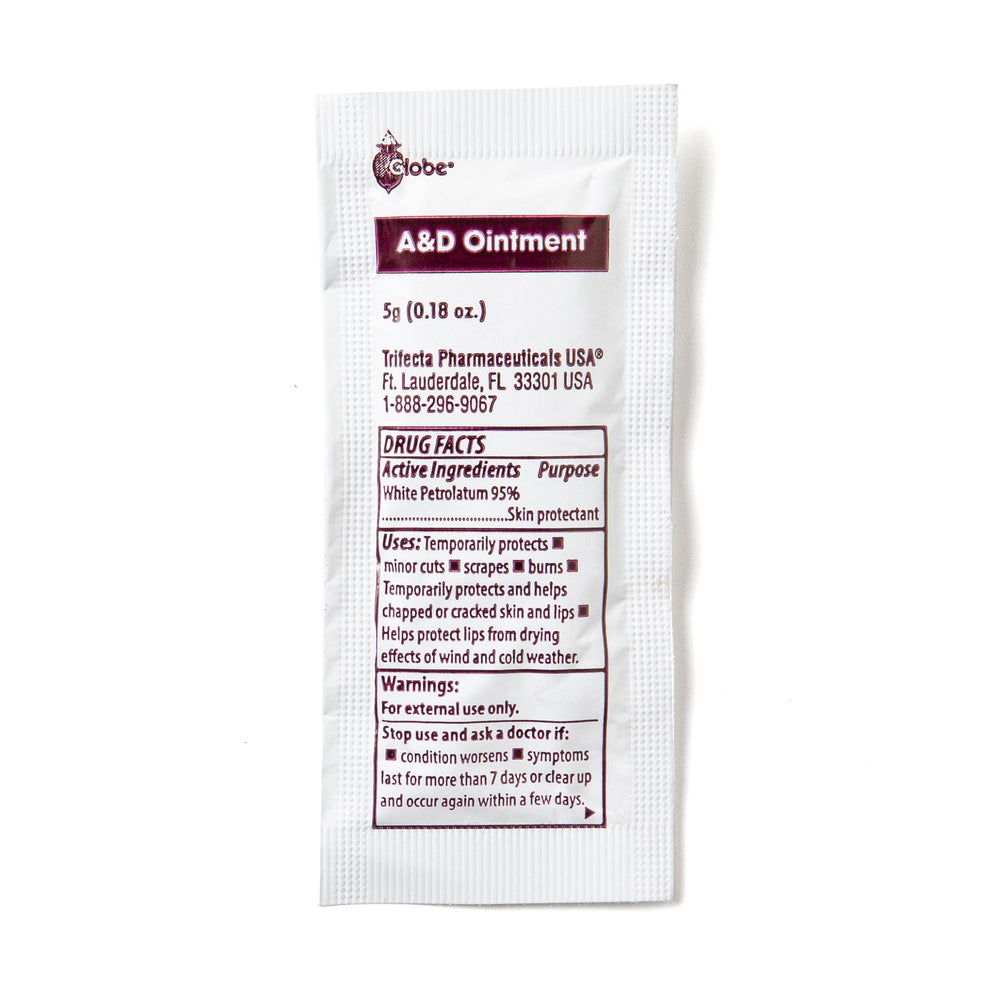 A small white packet labeled Globe Vitamin A & D Ointment contains lanolin and petrolatum, protects dry skin, minor cuts, burns, chapped lips; for men, women & babies. 5g packet from Globe. Made in the USA.