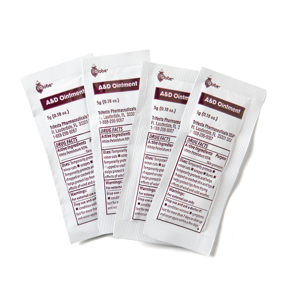 Four small white packets of Globe Vitamin A & D Ointment (5g each) are arranged in a row, displaying product details and usage instructions for dry, cracked skin, chapped lips, and minor cuts. Box contains 144 packets. Made in the USA.
