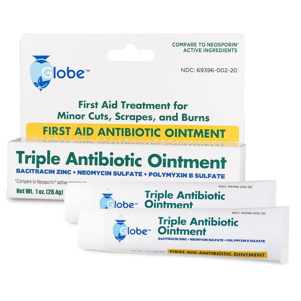 A box and tube of Globe First Aid Triple Antibiotic Ointment, 1oz, by Globe, labeled for first aid use on minor cuts, scrapes, and burns. The packaging highlights infection protection and lists active ingredients. Net weight: 1 oz (28.4g).